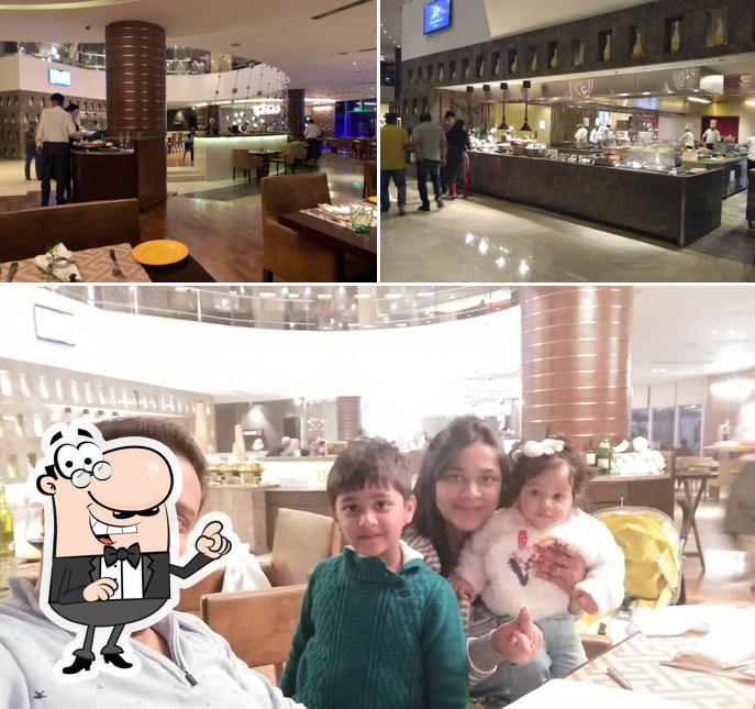 Take a seat at one of the tables at Mosaic - Global Cuisine Restaurant