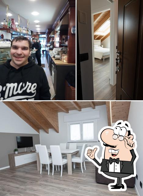 Guarda la foto che raffigura la interni e bancone da bar di Affittacamere Bar leo