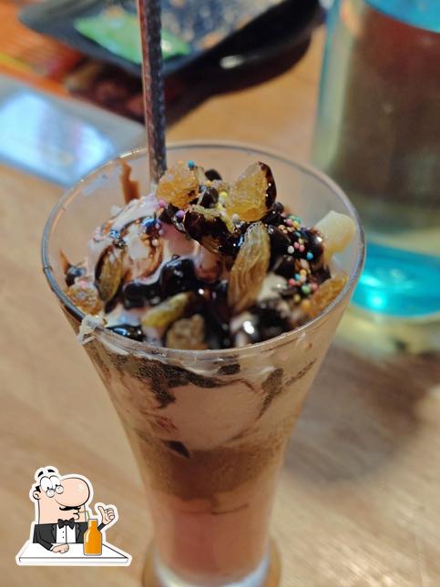 Enjoy a drink at Sizzlly Chicken Padappai