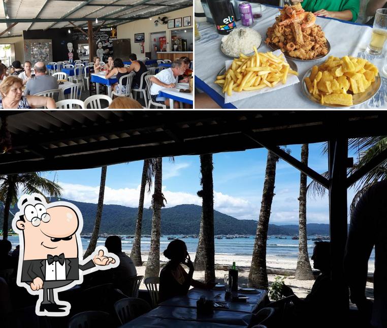 Esta é a foto apresentando interior e comida no O Farol - Perequê