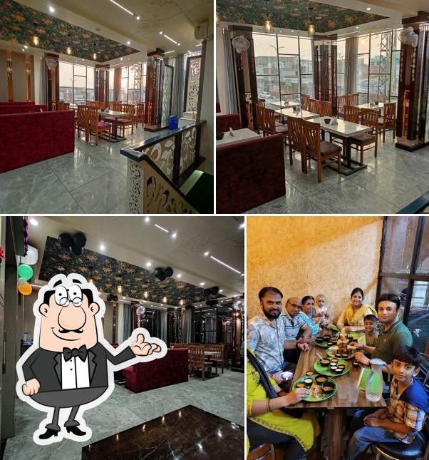 Take a seat at one of the tables at Hamza Non Veg Restaurant