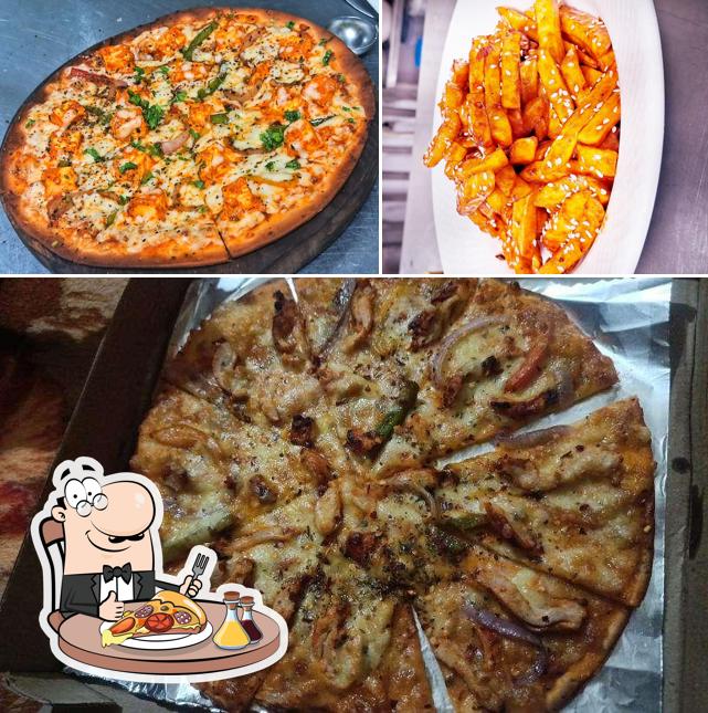 Get pizza at Hangover bar & cafe