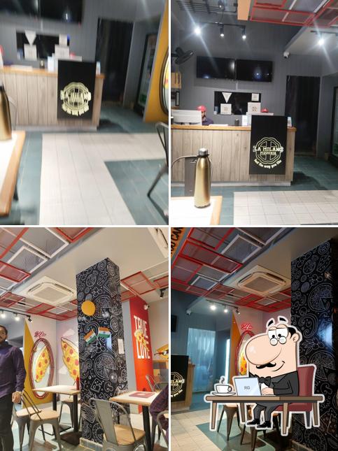 Take a seat at one of the tables at La Milano Pizzeria