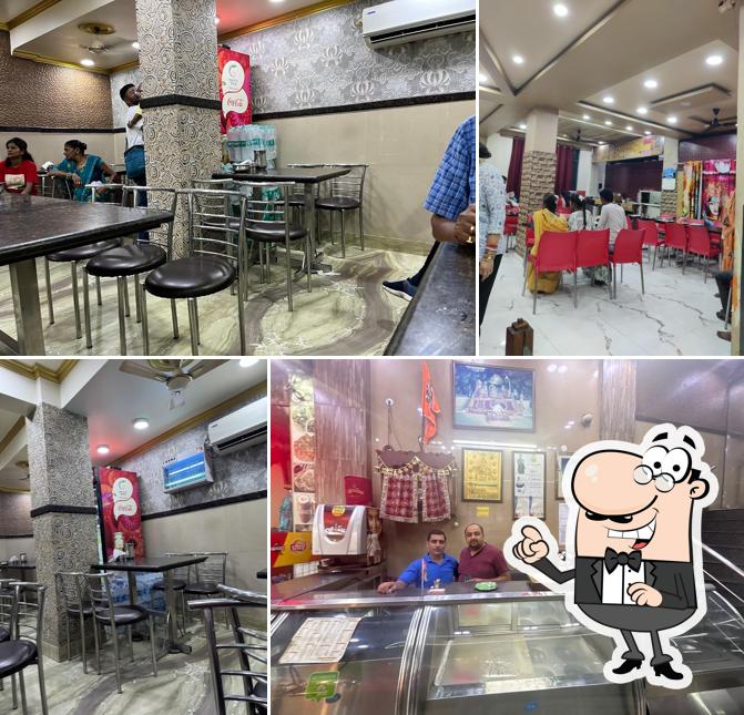 Take a seat at one of the tables at Pooja Vaishno Dhaba