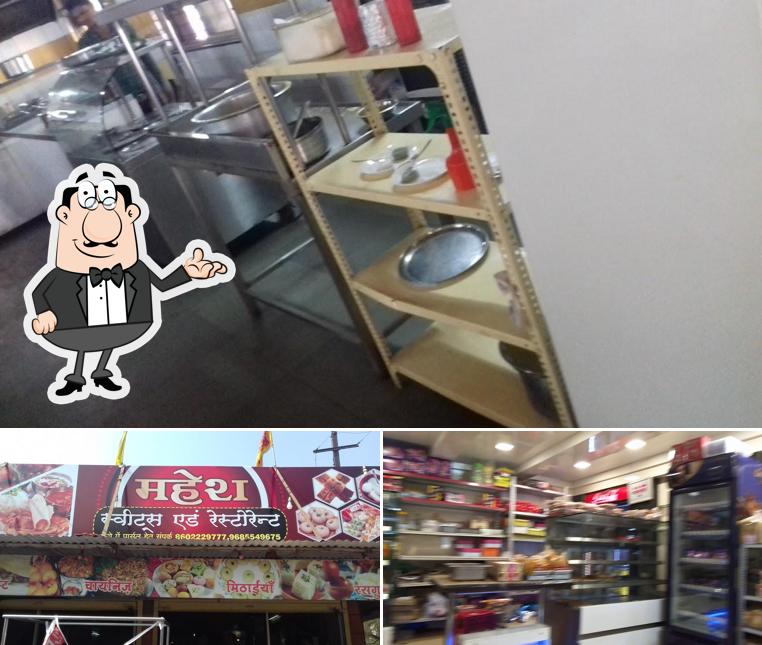 Take a seat at one of the tables at Mahesh Restaurant