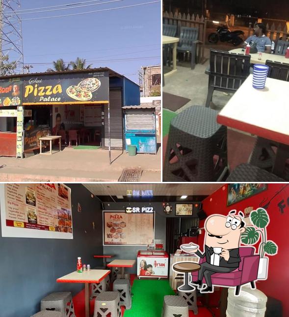 The image of interior and food at SAI PIZZA PALACE