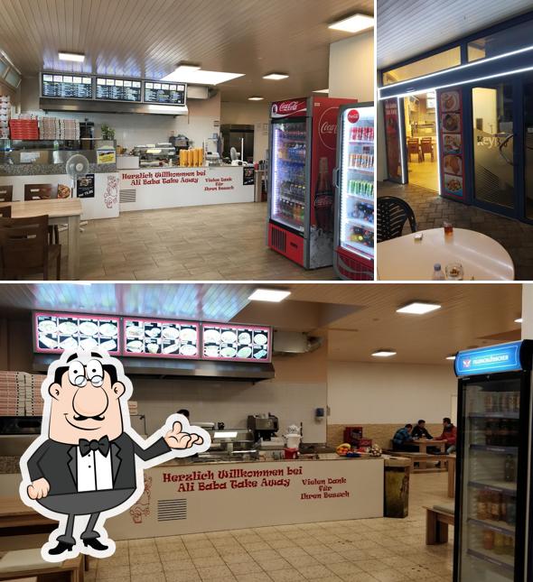 Siediti a un tavolo di Pirsus Imbiss und Mini Markt