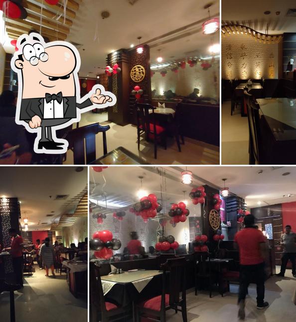 Take a seat at one of the tables at Silver Streak sahid nagar