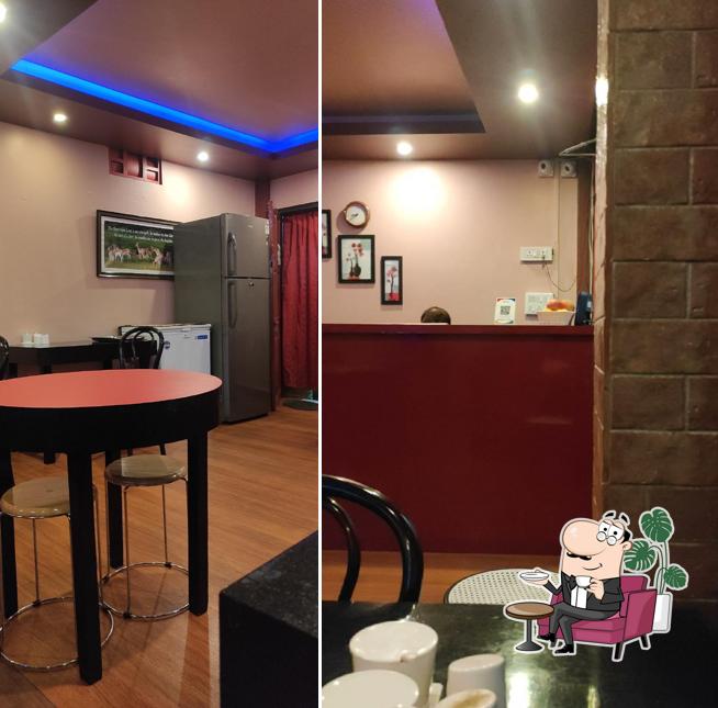 Take a seat at one of the tables at Kenfi Restaurant