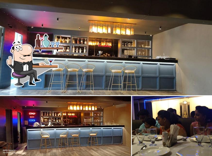 Take a seat at one of the tables at Kwality Restaurant & Bar