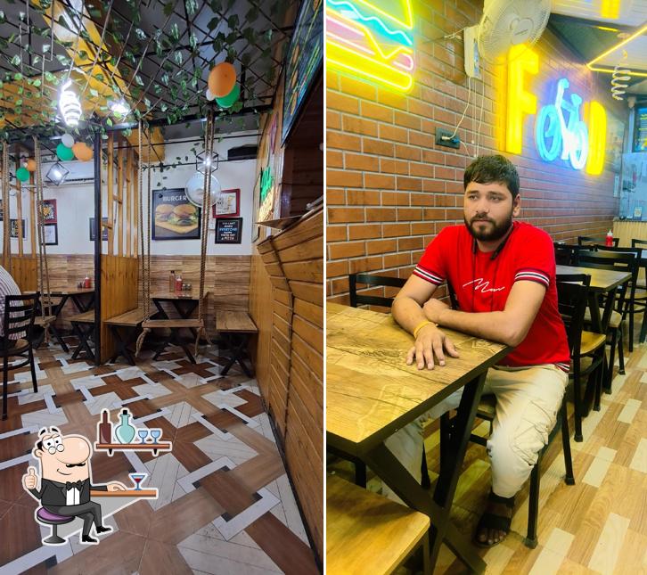 Take a seat at one of the tables at Rockers Pizza