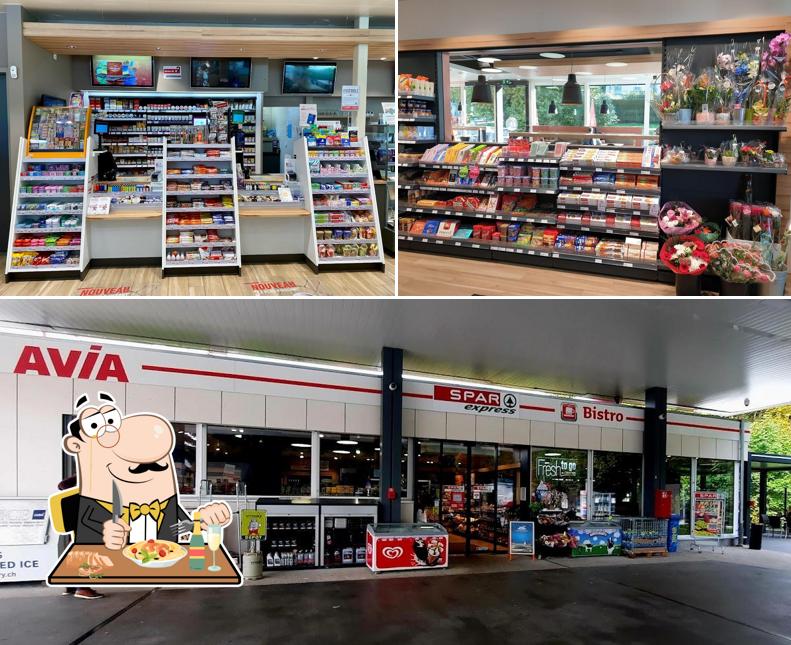 Questa è la immagine che mostra la cibo e esterno di Avia Puidoux - Station-service avec shop