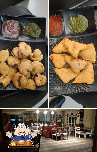 The photo of Hotel Malik Regency Ambala City’s food and interior