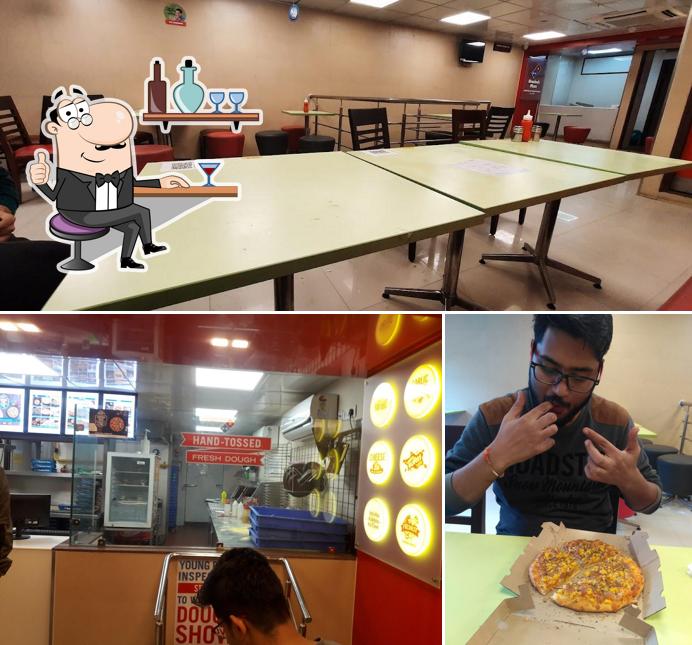 This is the image showing interior and dining table at Domino's Pizza MP Nagar Zone-2 , Bhopal