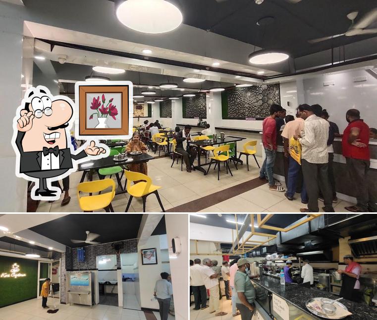 Take a seat at one of the tables at Kini Cafeteria