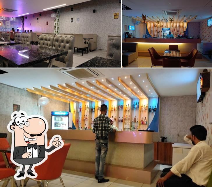Take a seat at one of the tables at TRT BAR - The Rich Table Best Bar and Restaurant in Lucknow