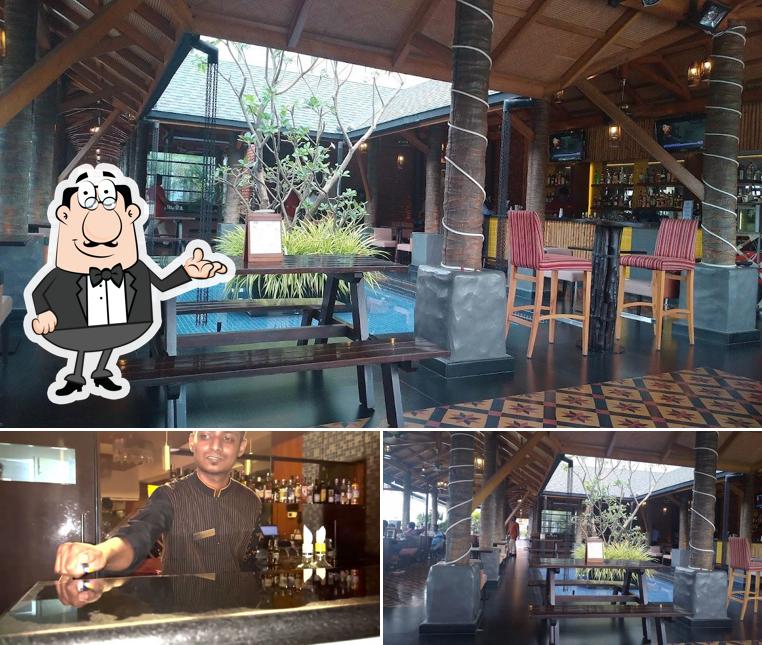 Take a seat at one of the tables at Urban Dhaba - Radisson Salem