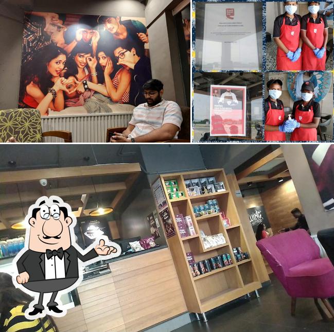 Take a seat at one of the tables at Café Coffee Day
