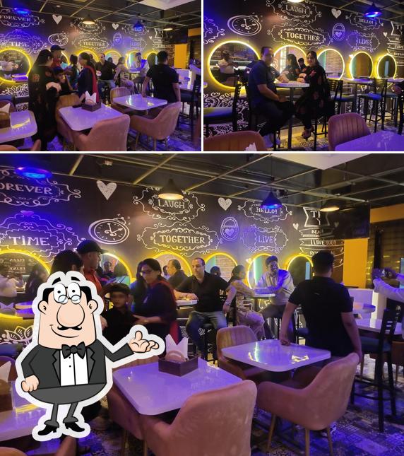 Take a seat at one of the tables at 24 Carat Food Plaza
