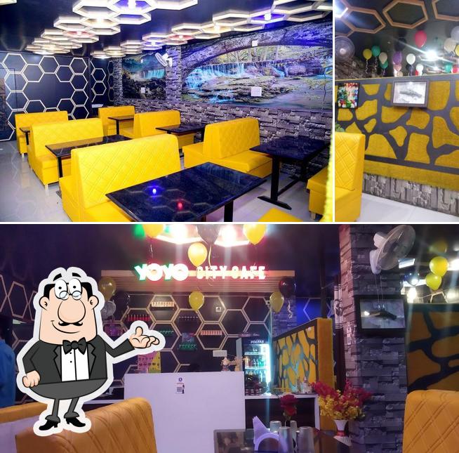 Take a seat at one of the tables at YoYo City Cafe & Restaurant