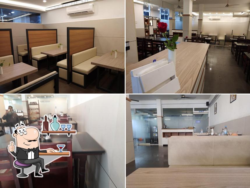 Take a seat at one of the tables at Rajmahal Ruchi Restaurant