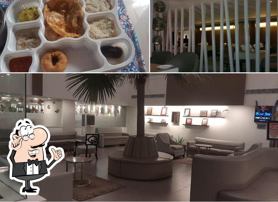 Take a look at the image depicting interior and food at Minerva Grand Tirupati