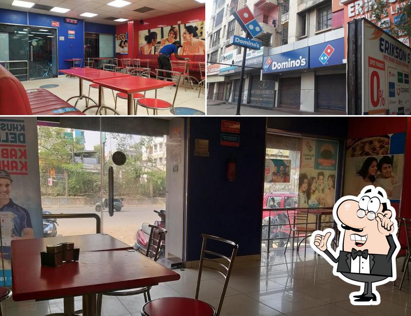 Take a seat at one of the tables at Domino's Pizza Ulidh, Jamshedpur