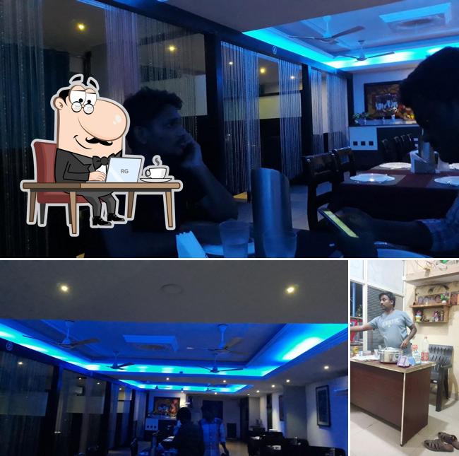 Check out the picture depicting interior and beverage at Sukhibhava A/c family restaurant