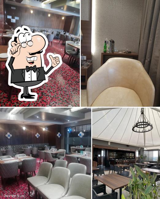 Take a seat at one of the tables at Hotel Radiance Multi-cuisine Restaurant