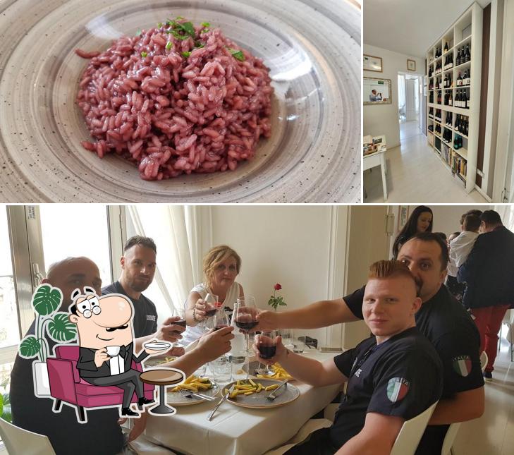 Dai un’occhiata alla immagine che mostra la interni e cibo di Acqua e Vino