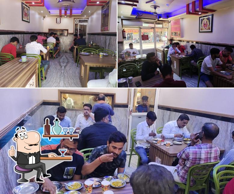 Take a seat at one of the tables at Bejeesh Hotel