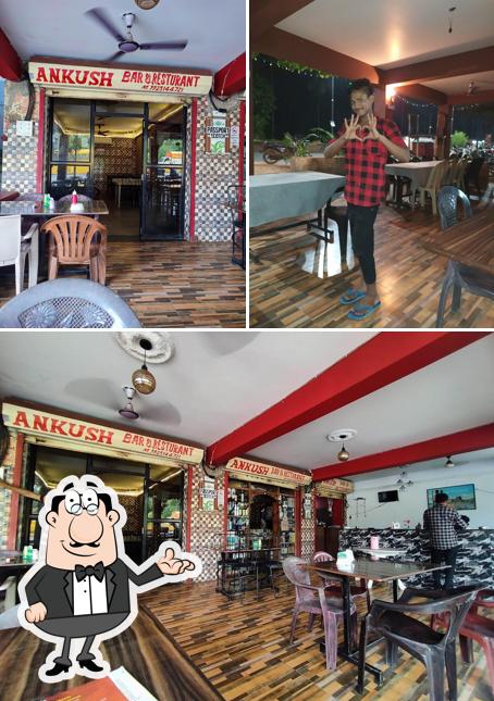 Take a seat at one of the tables at Ankush Bar & Restaurant