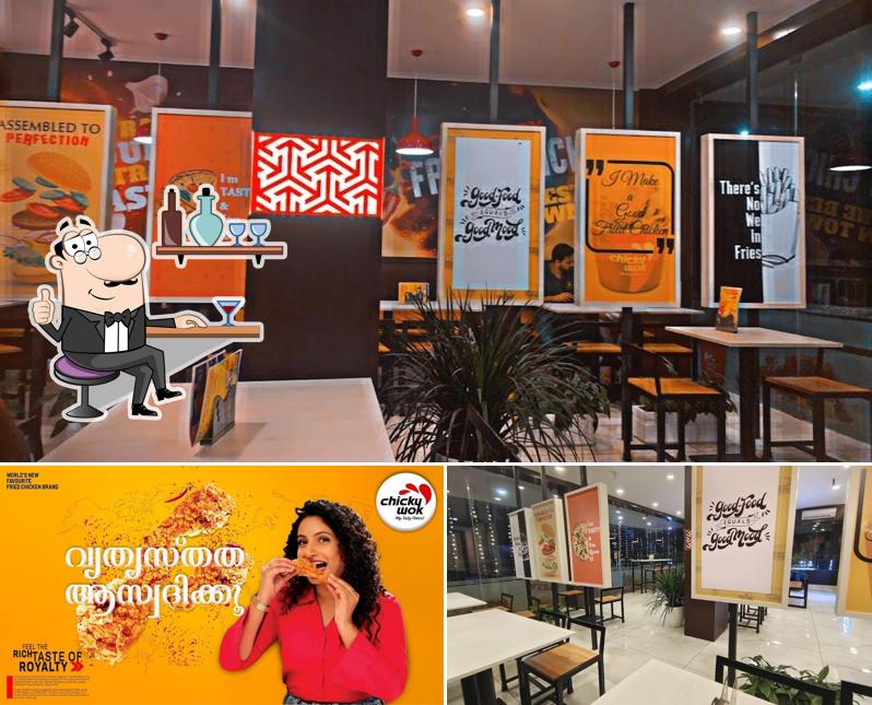 Take a seat at one of the tables at ChickyWok Kolenchery