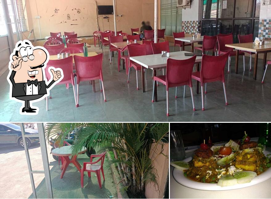 The photo of interior and beverage at Rasoi Hotel
