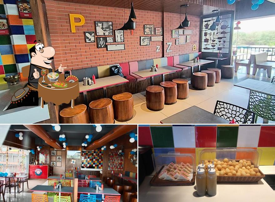 The picture of food and interior at Pizza Zone - Nadiad