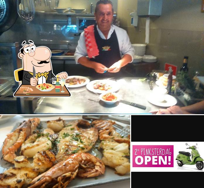 Questa è la immagine che mostra la cibo e esterno di Trattoria Da Angelo