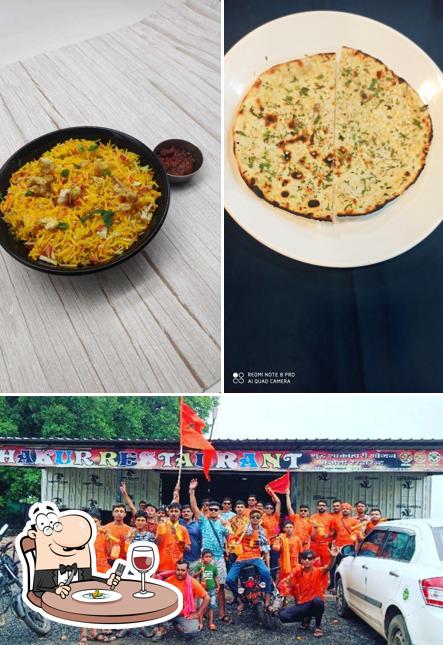 The photo of Thakur Restaurant’s food and exterior