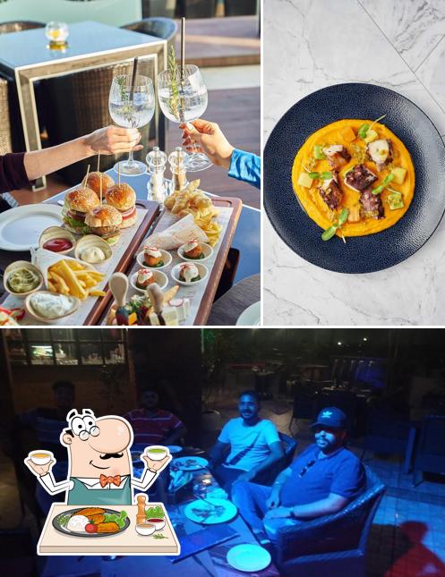 Check out the image showing food and interior at Sky Grill Restaurant Mohali