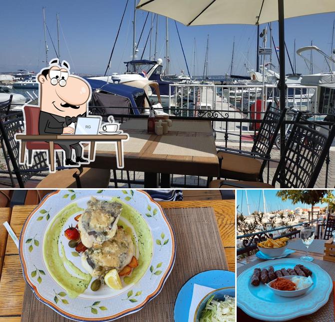 La foto della interni e cibo di Konoba Roko
