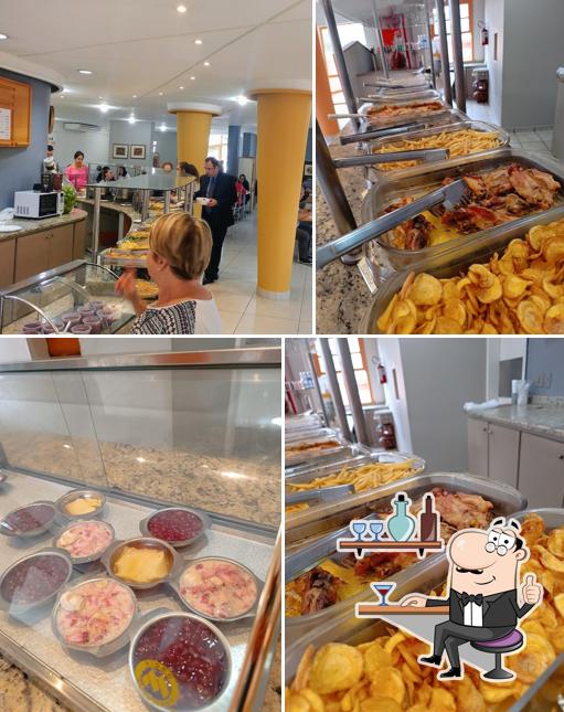 Sente em uma das mesas no Positano Restaurante Ltda