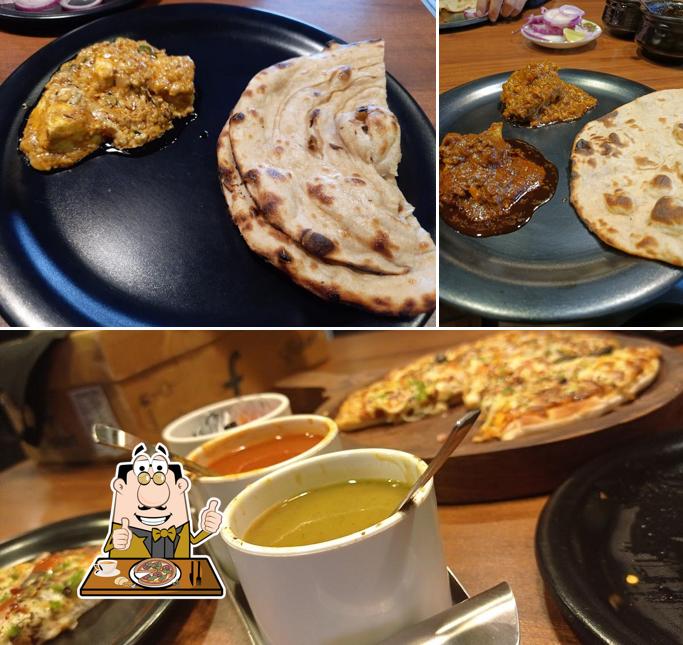 Get pizza at Anandam Restaurant