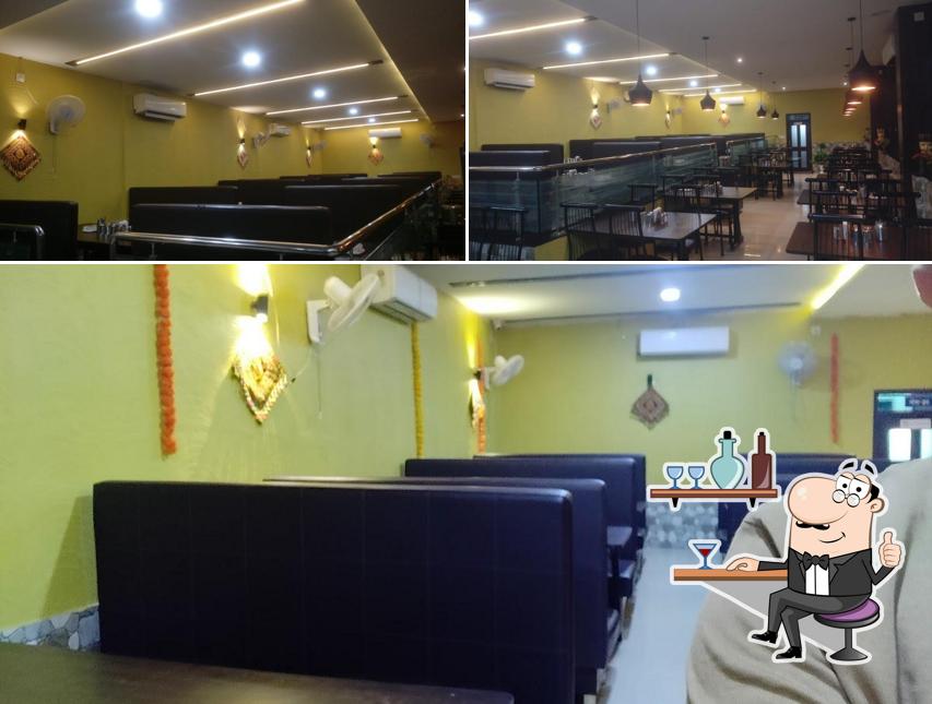 Take a seat at one of the tables at Real Kathiyavadi Restaurant - Best Kathiyawadi Restaurant