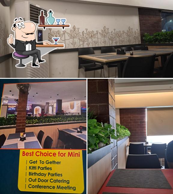 Take a seat at one of the tables at Green Bowl Restaurant