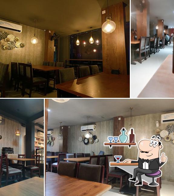 Take a seat at one of the tables at Qahwa Karicode