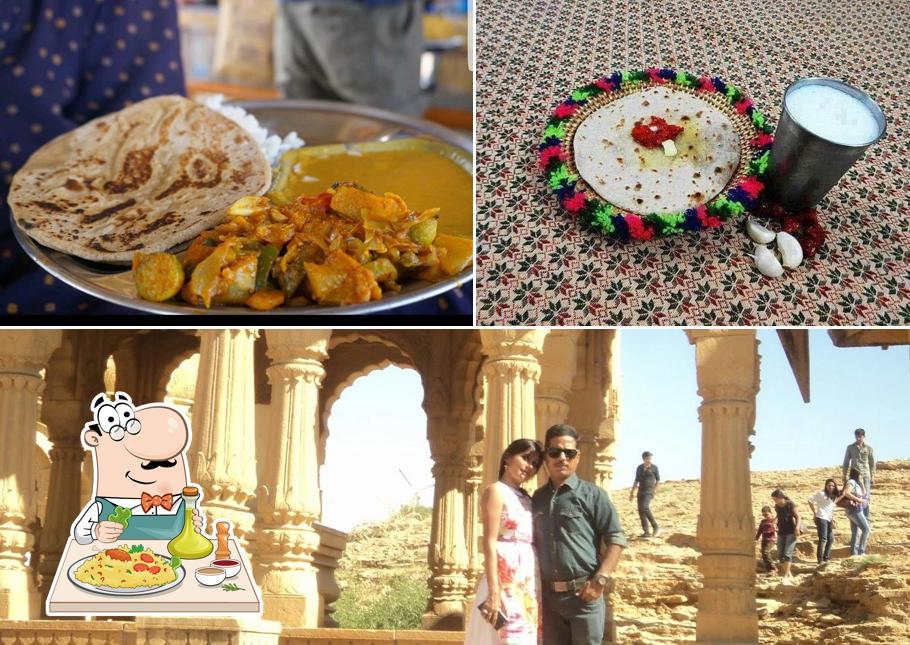 Check out the photo showing food and exterior at The Desert Village Safari