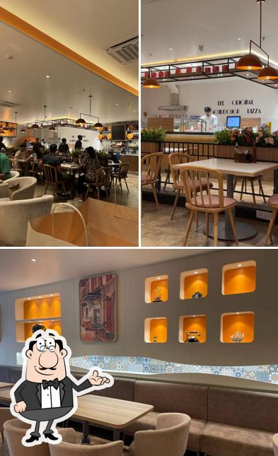 The interior of Si Nonna's - The Original Sourdough Pizza Shivalik Shilp Ahmedabad