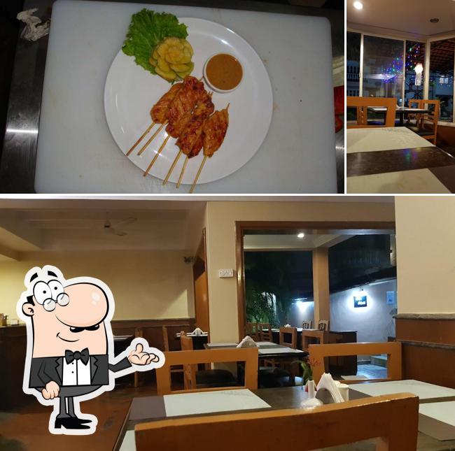 Check out the photo showing interior and food at Sea Wave