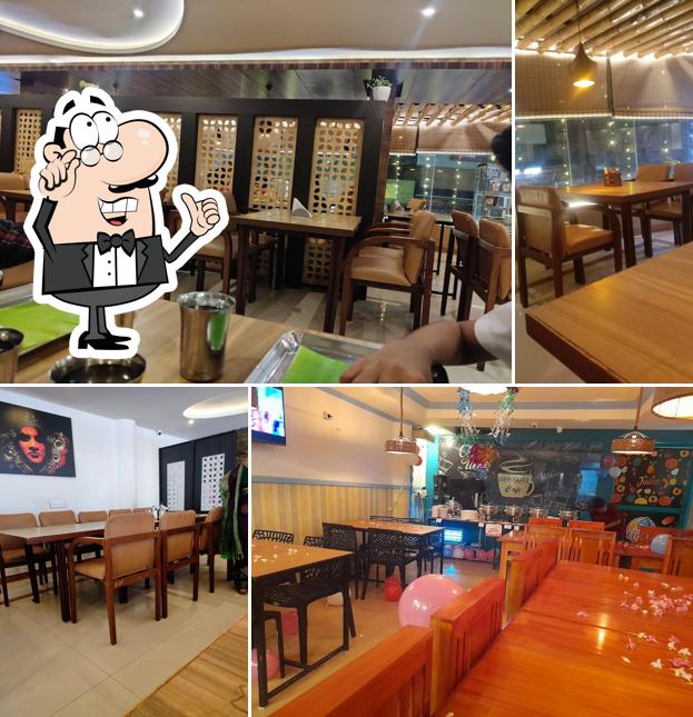 Take a seat at one of the tables at Ruchi Veg Restaurant