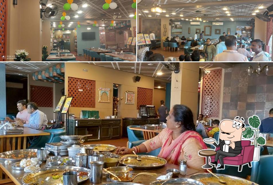 Take a seat at one of the tables at The Taste Of Bharuch - Shree Khodiyar Kathiyawadi Dhaba