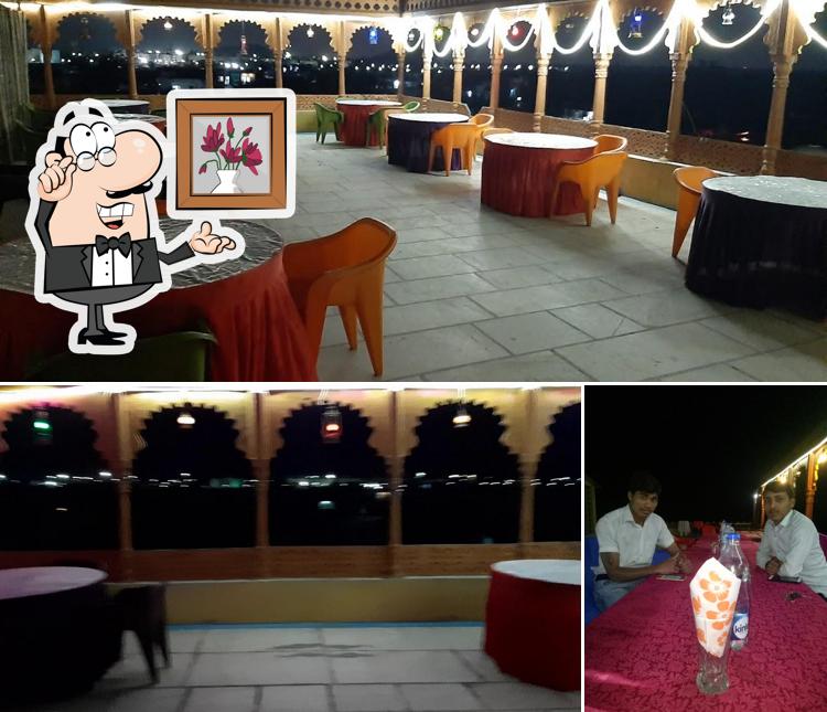 Take a seat at one of the tables at Taj Roof top restaurants